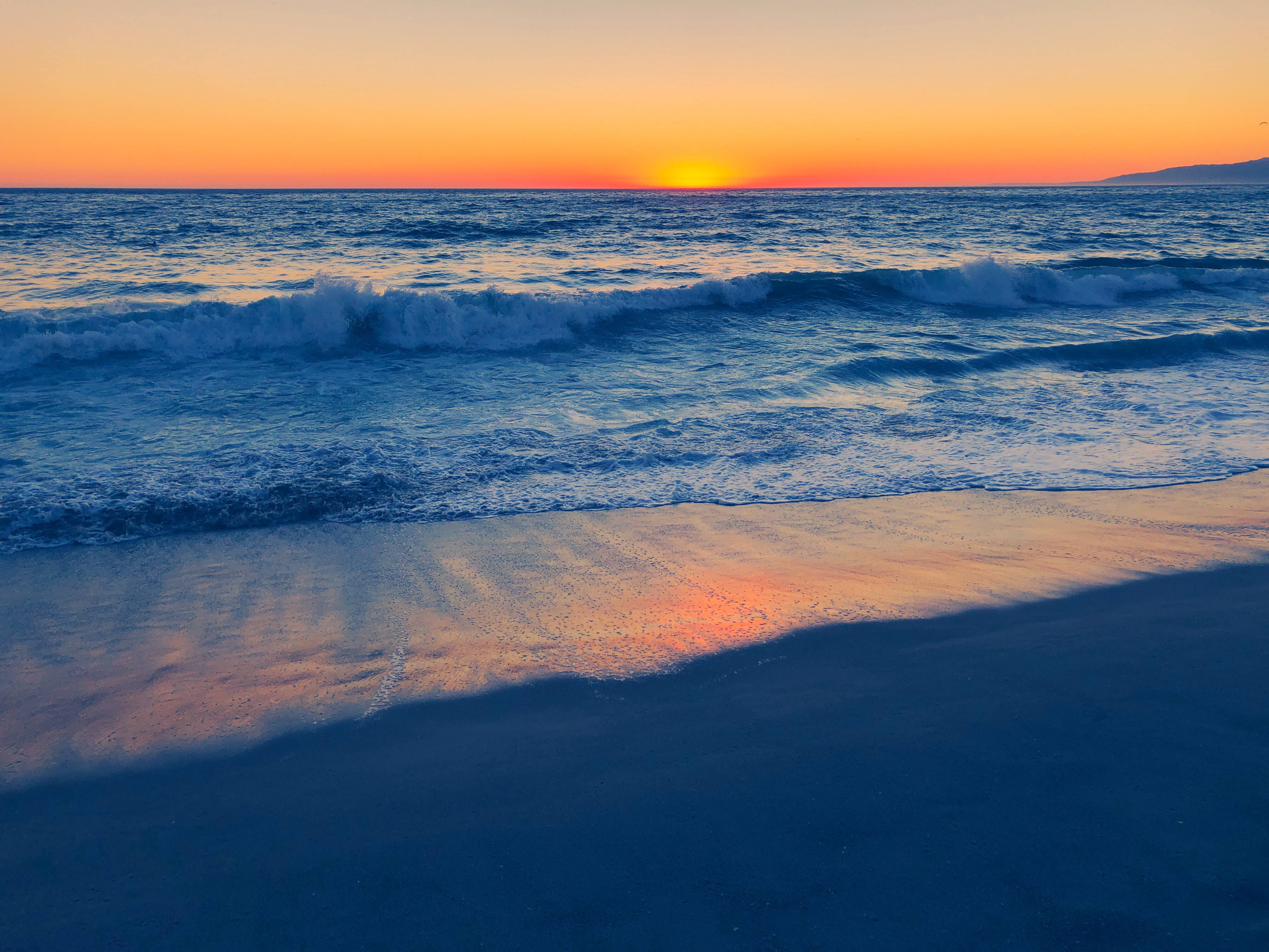 Apus de soare pe Venice Beach, Los Angeles Fundal