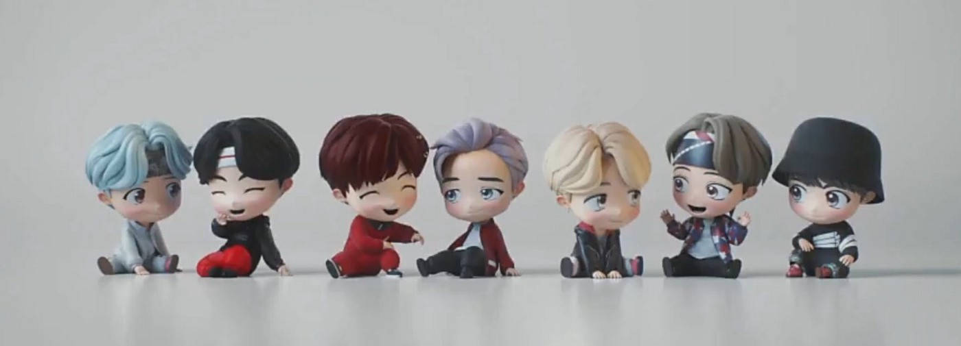 Bucură-te de aspectul amuzant și adorabil al păpușilor Tiny Tan BTS! Fundal