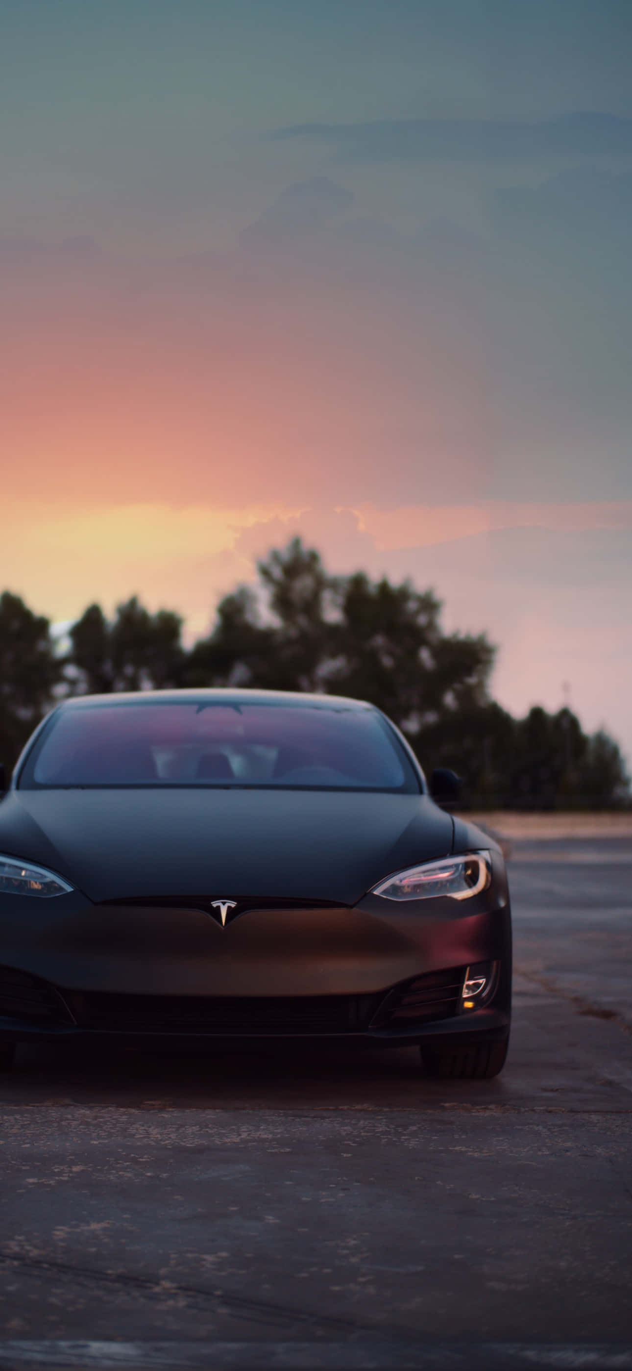 Bucură-te de o lume wireless cu Tesla iPhone. Fundal