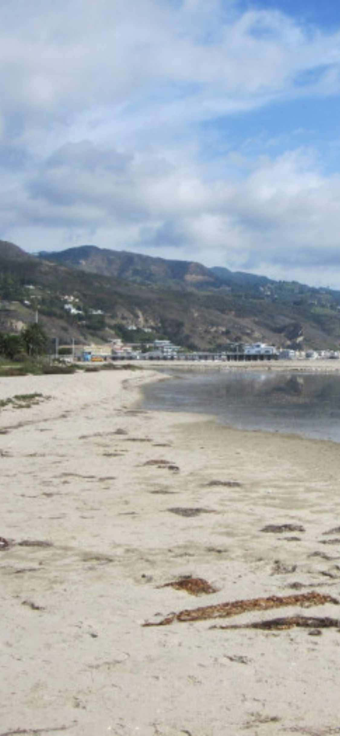 Bucură-te de vederi pitorești ale Malibu de pe iPhone XS Fundal