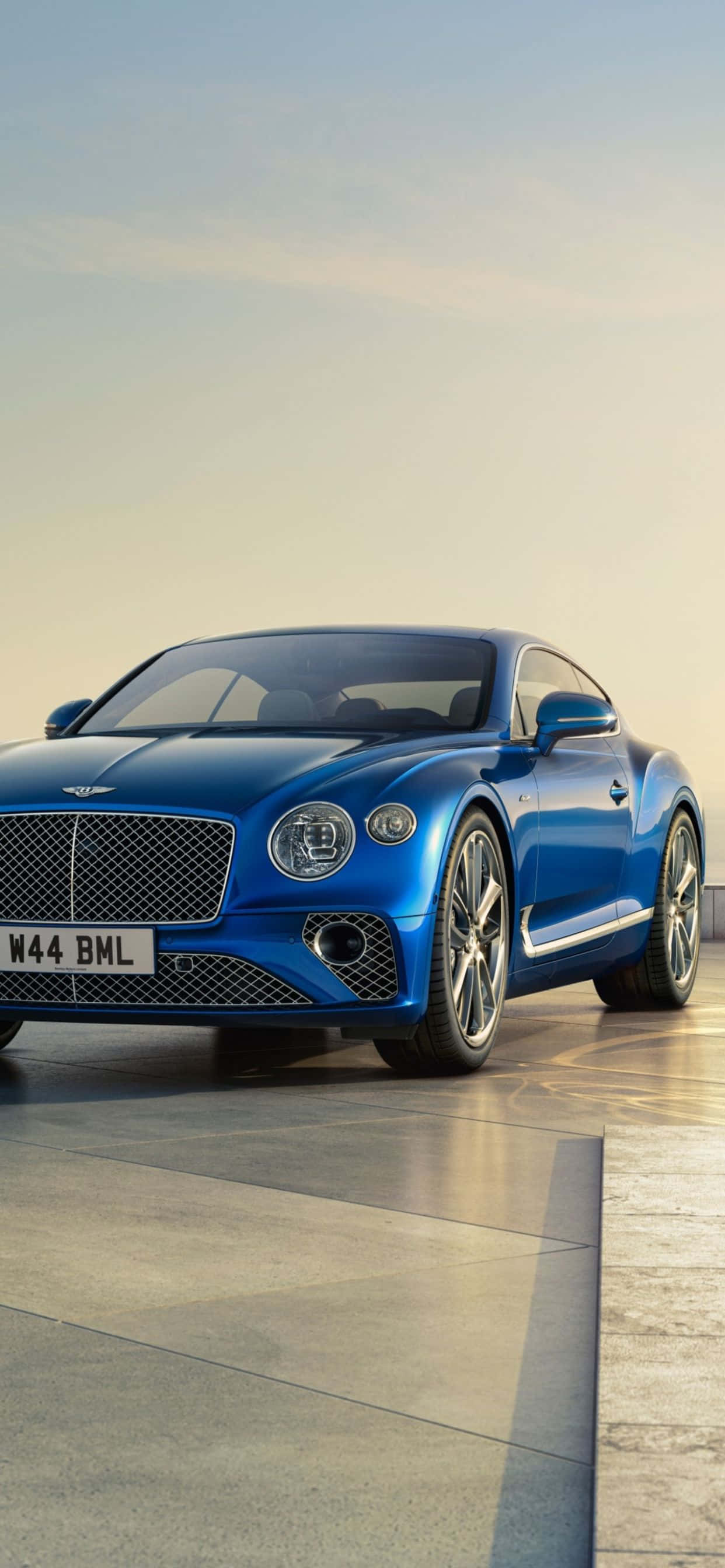 Bucură-te de luxul iPhone Xs Max și al unui Bentley Fundal