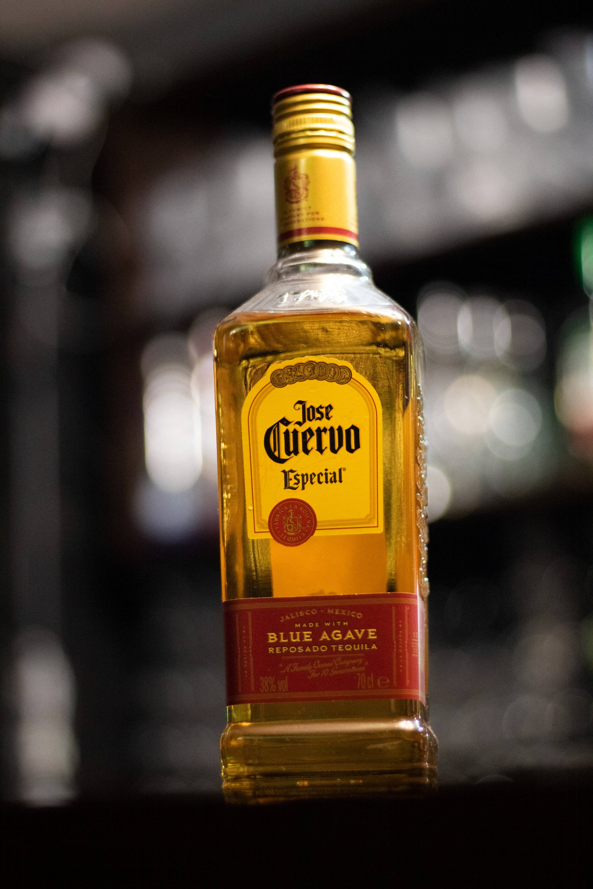 Caption: Elegant Jose Cuervo Agave Tequila Bottle Fundal