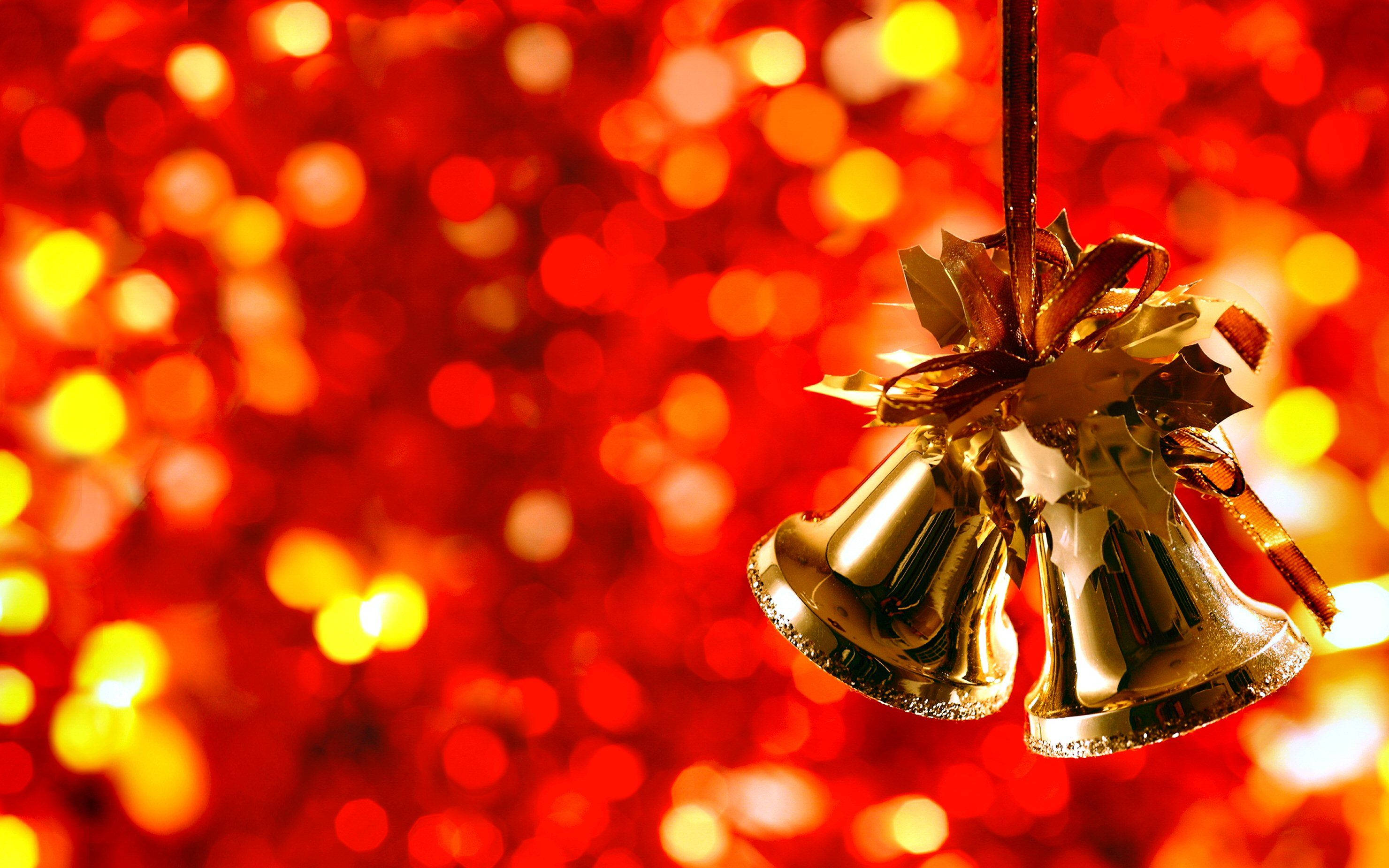 Clopoței aurii de Crăciun cu efect bokeh festiv Fundal