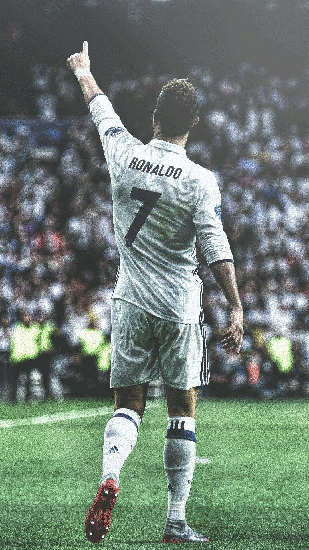 Cristiano Ronaldo arătând în sus pentru iPhone Fundal