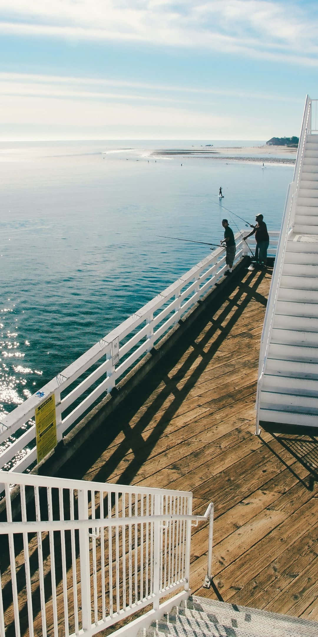 Doi pescari pe fundal Malibu pentru Pixel 3 Fundal