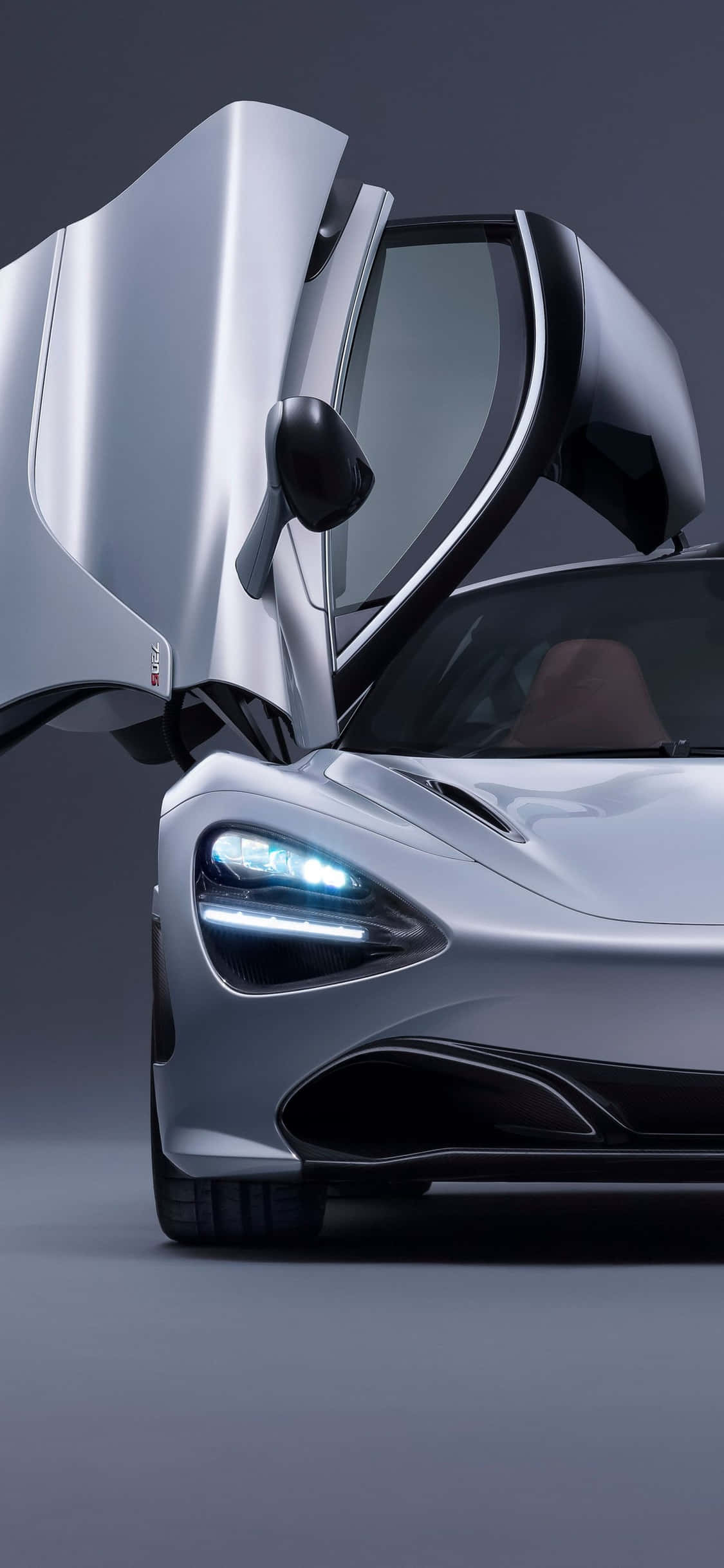 Experimentați puterea și viteza iPhone Xs cu McLaren 720s Fundal