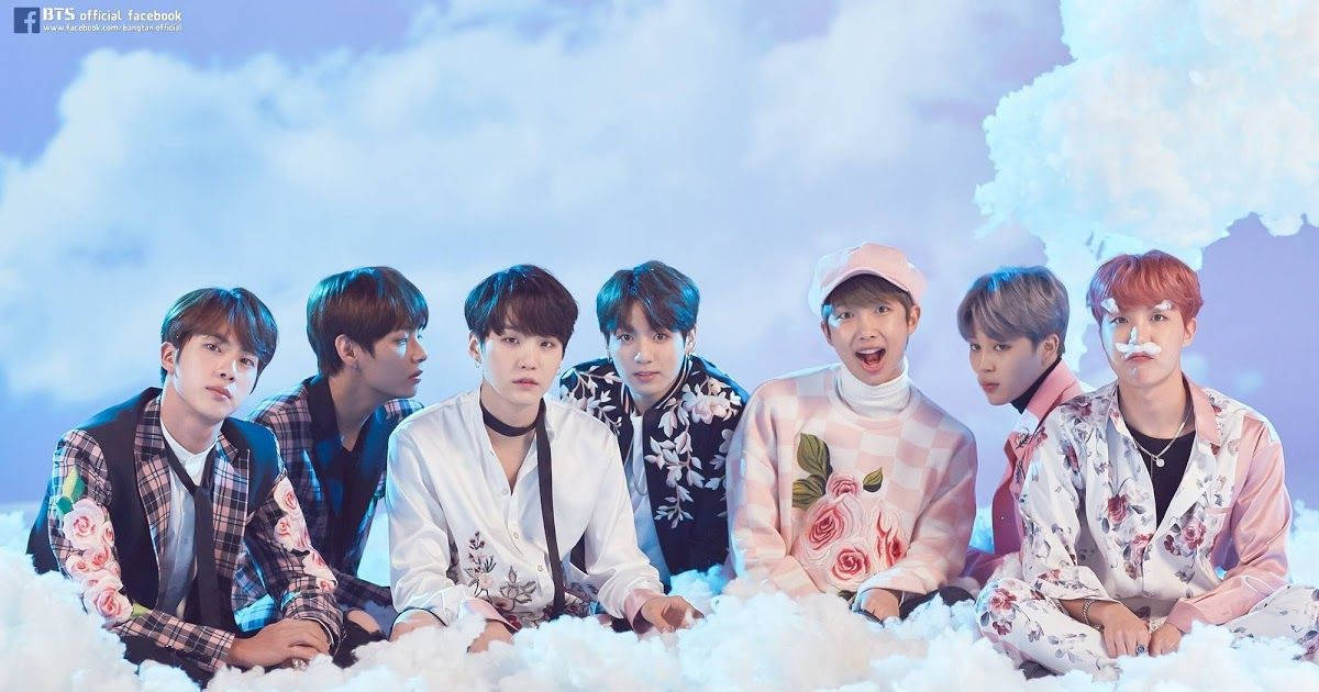 Fotografie de grup BTS pe nori Fundal