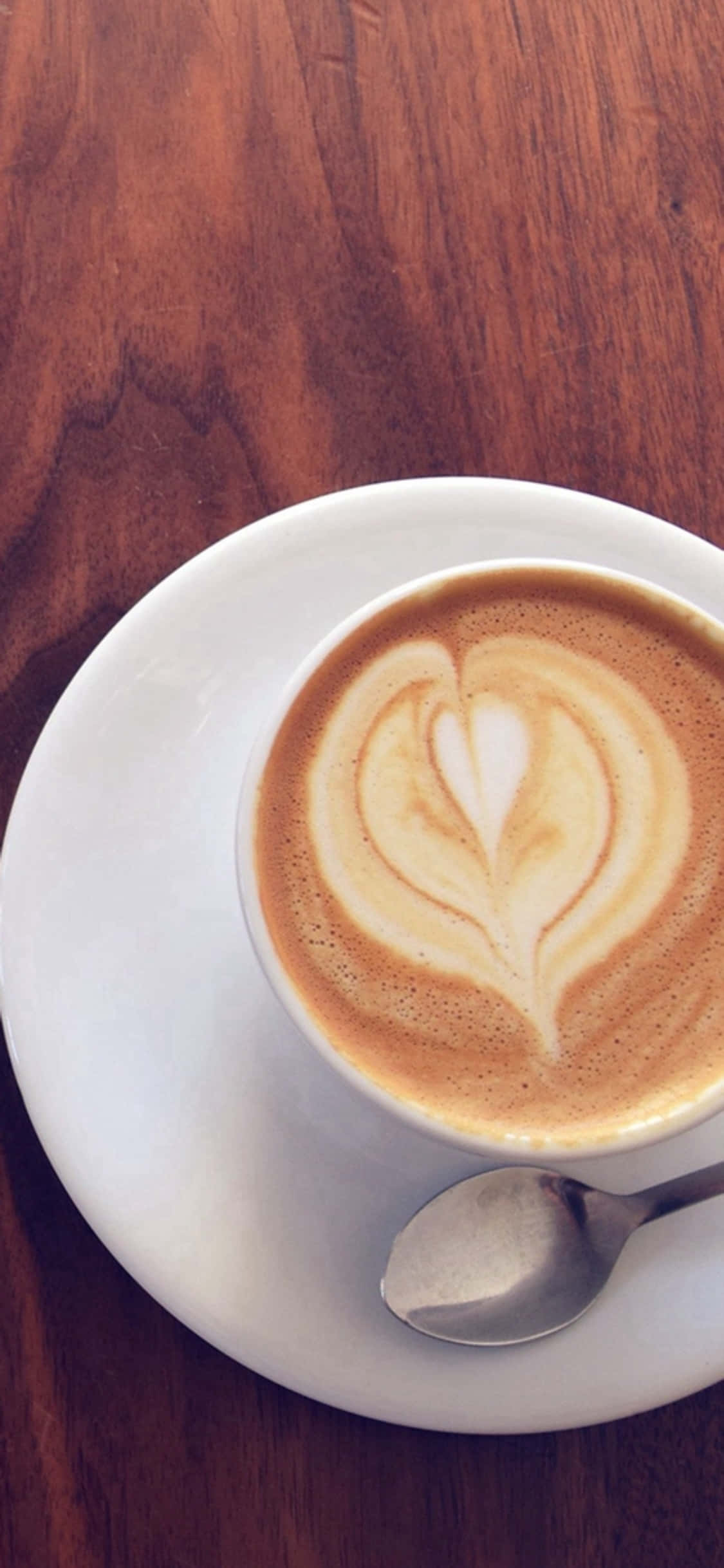 Fundal iPhone X cu birou și ceașcă de cafea spumosă Fundal