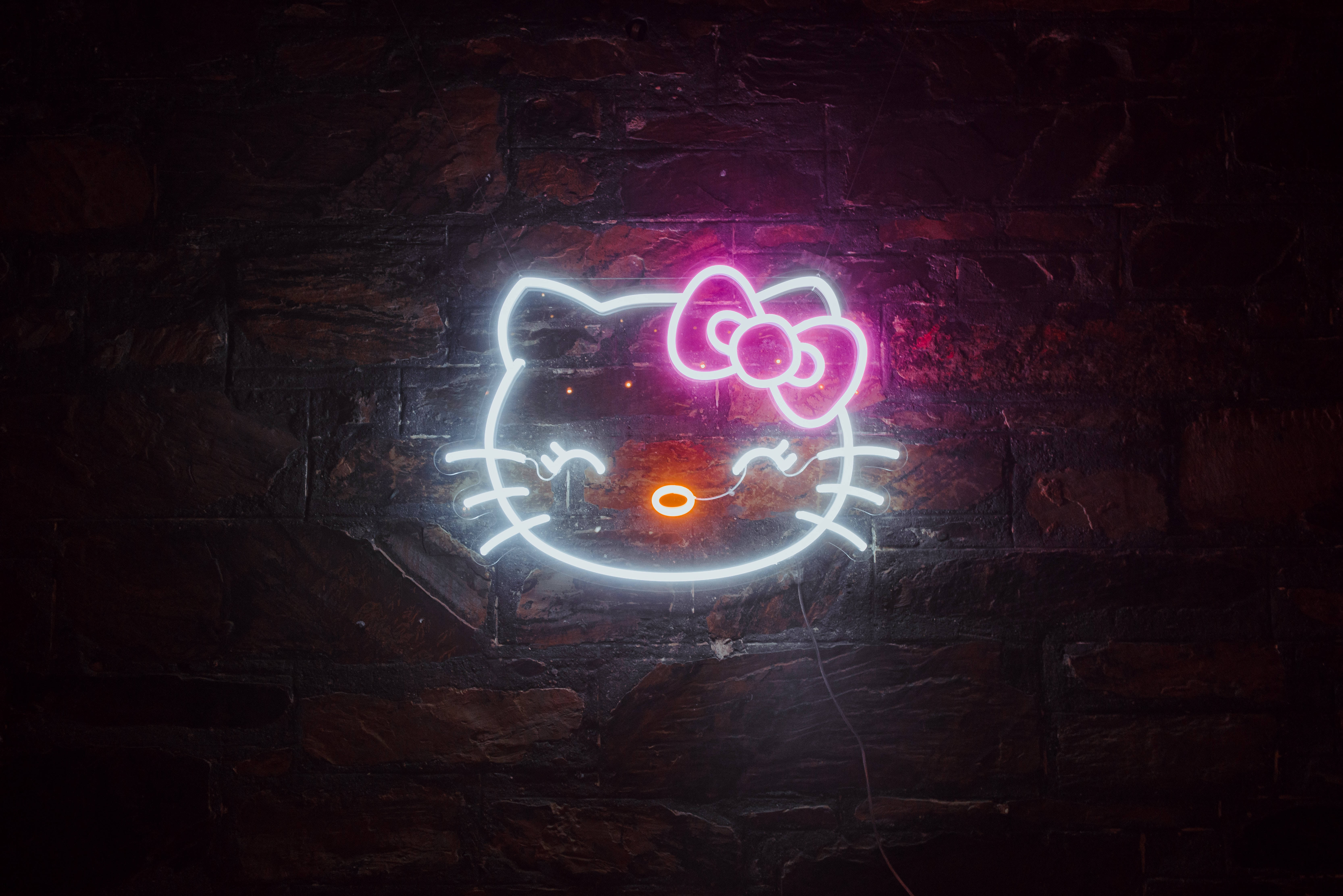 Hello Kitty neagră în lumini de neon Fundal