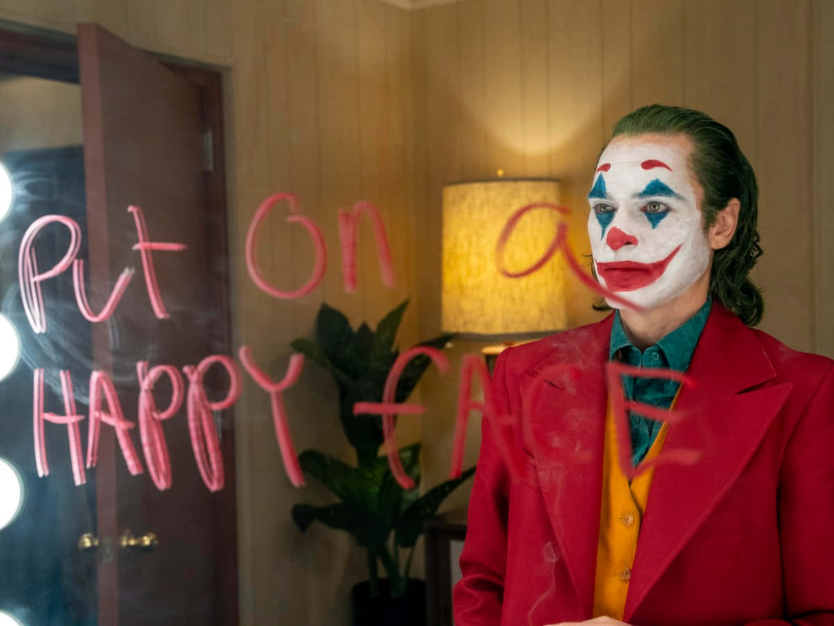 Joaquin Phoenix în rolul Jokerului de la DC Fundal