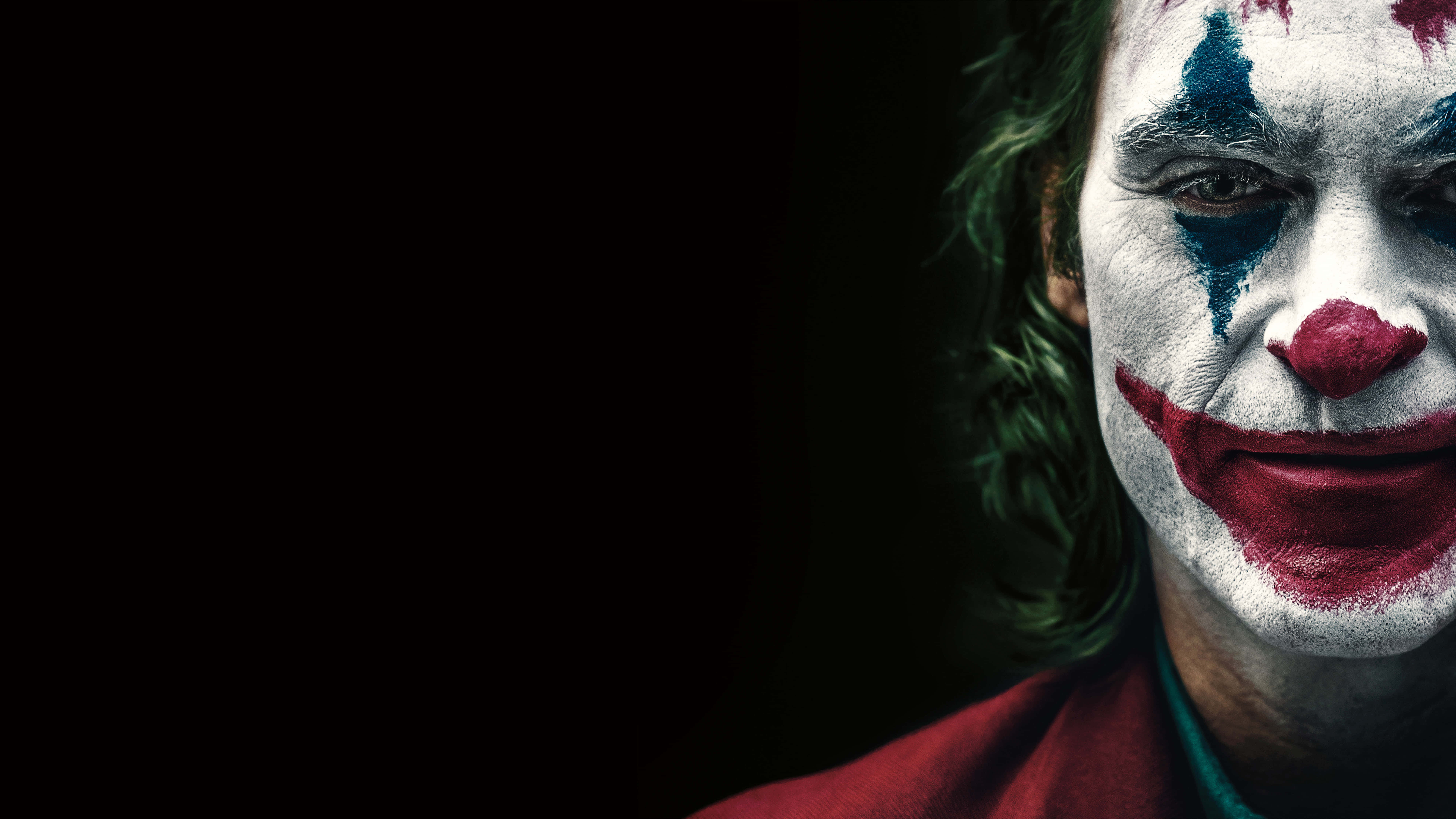 Joker cool cu buze roșii și fundal negru Fundal