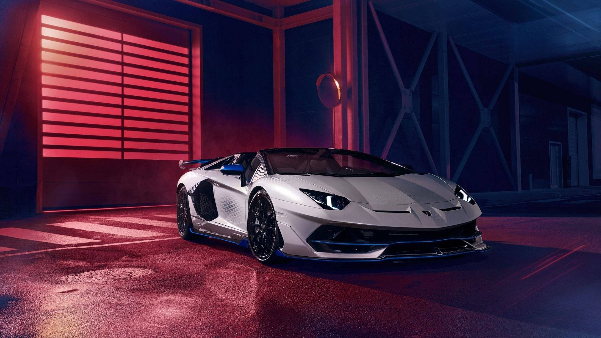 Legenda: Un uluitor Lamborghini Aventador SVJ Xago în albastru miezul nopții Fundal