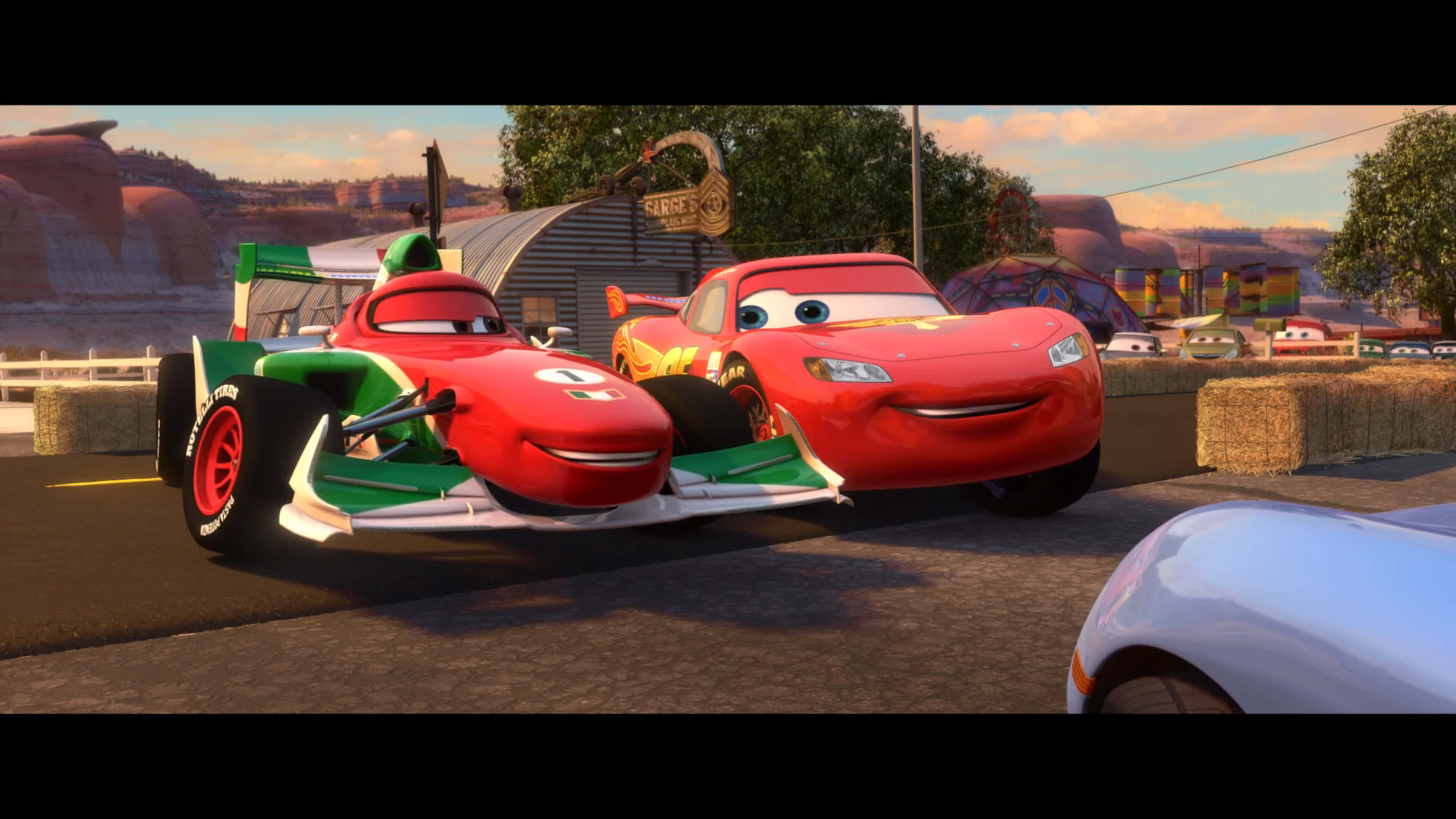 Lightning McQueen înfruntă Marele Premiu Mondial pe Drumul spre Victorie Fundal