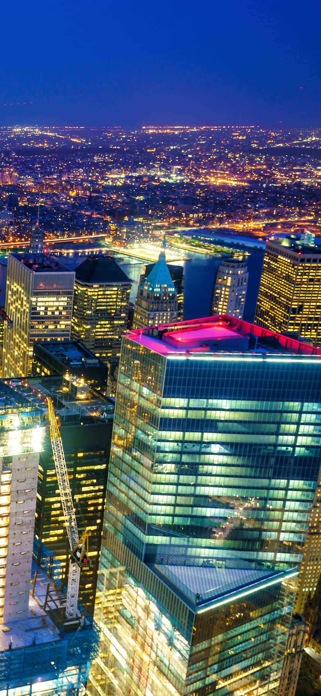 Luminile de noapte ale orizontului iconic al New York-ului văzute de Apple iPhone Xs Fundal