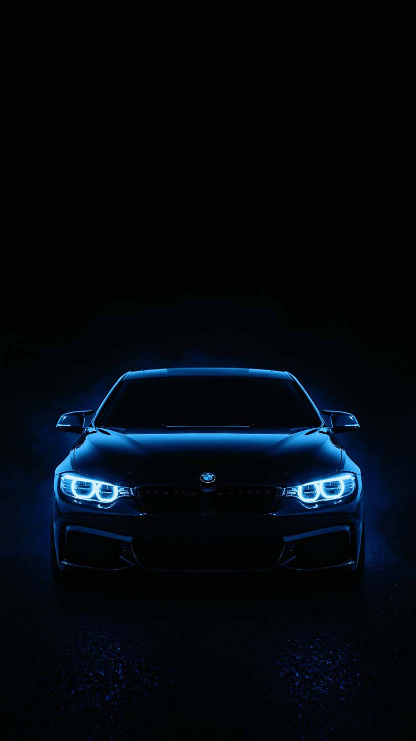 Mașină BMW GT4 neagră și elegantă în mișcare Fundal