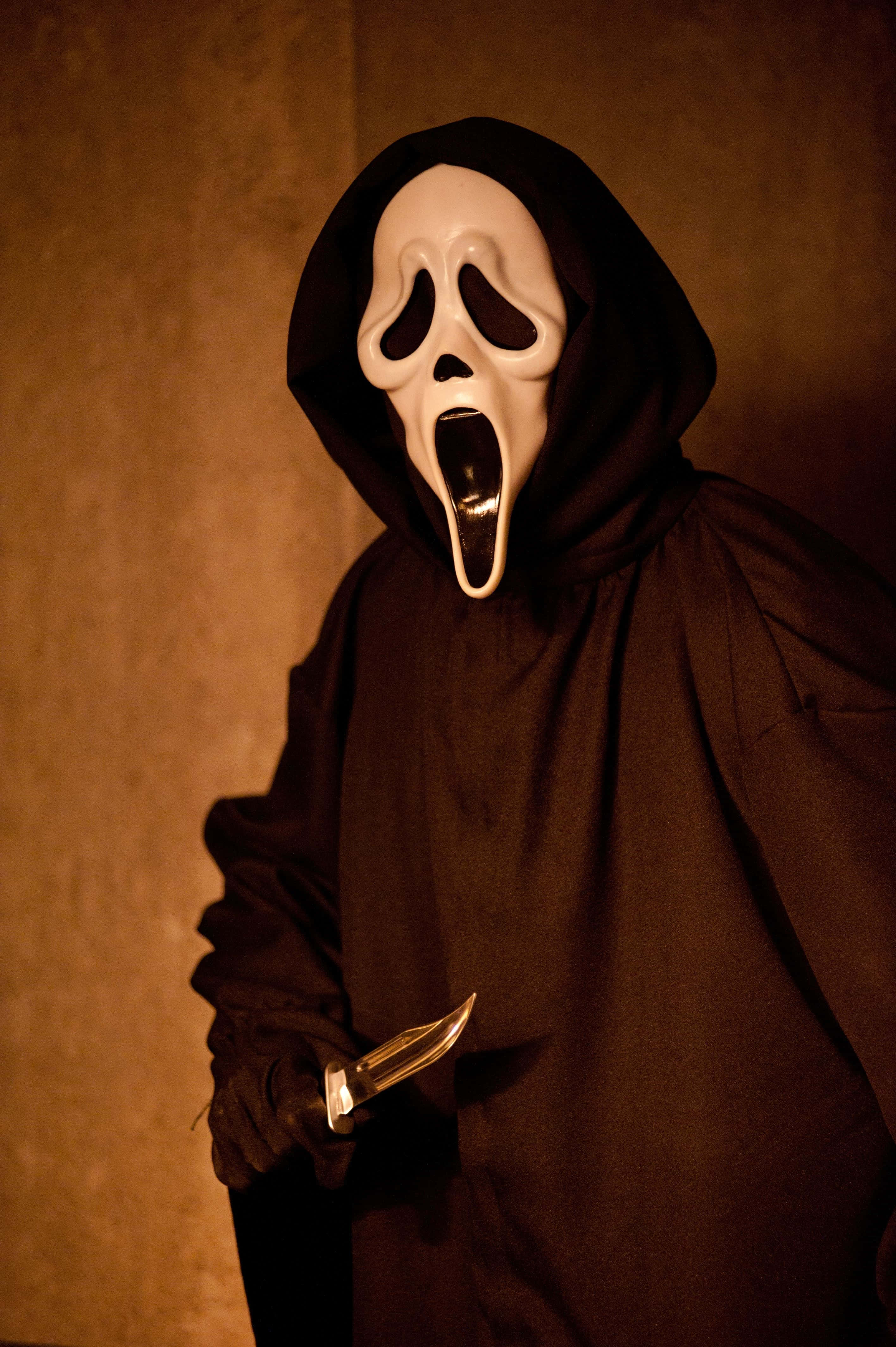 Misteriosul Ghostface în Umbră Fundal