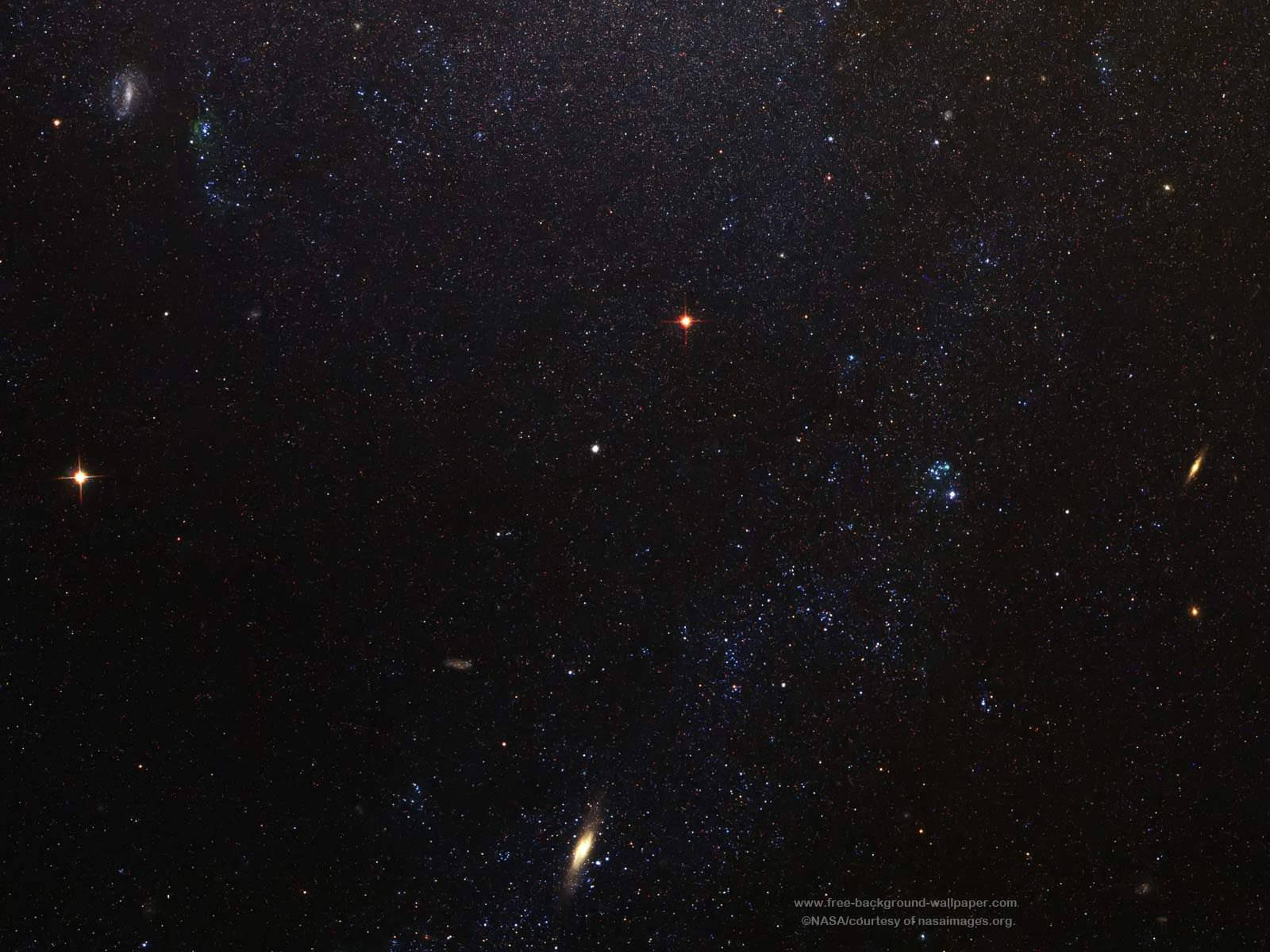O galaxie spiralată frumoasă cu stele împrăștiate pe întinderea sa vastă Fundal