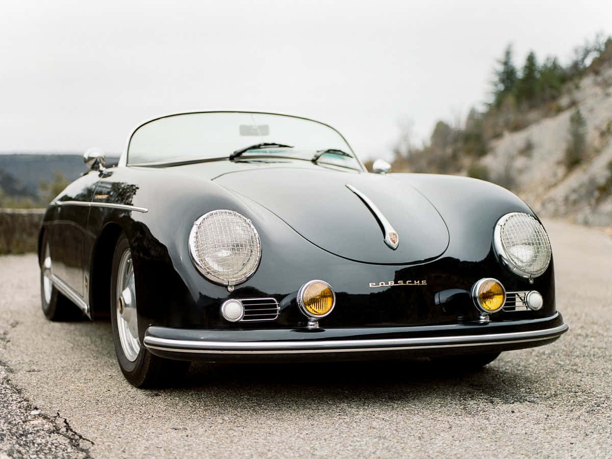 porsche 356 speedster - o mașină sport clasică neagră Fundal