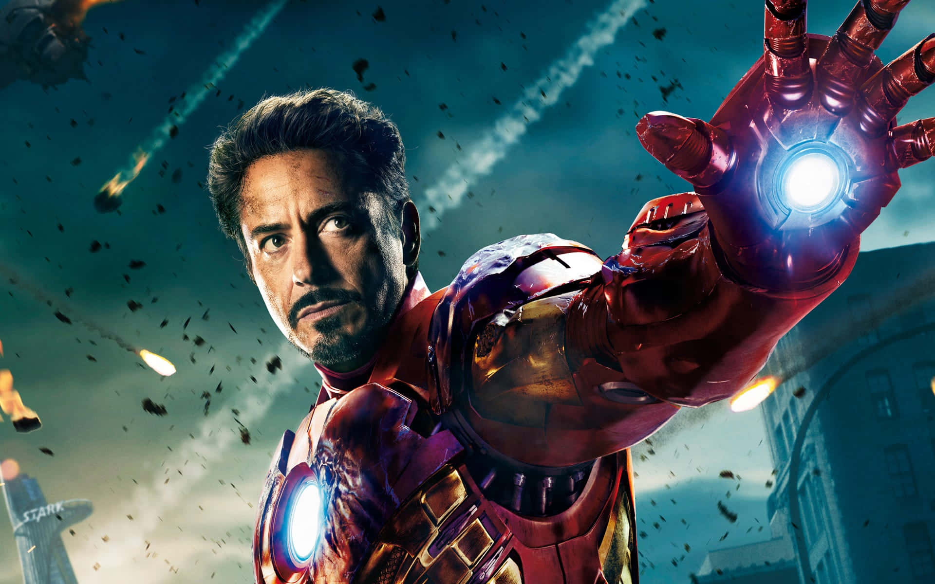 Robert Downey Jr. ca Iron Man în fața unui oraș distrus Fundal