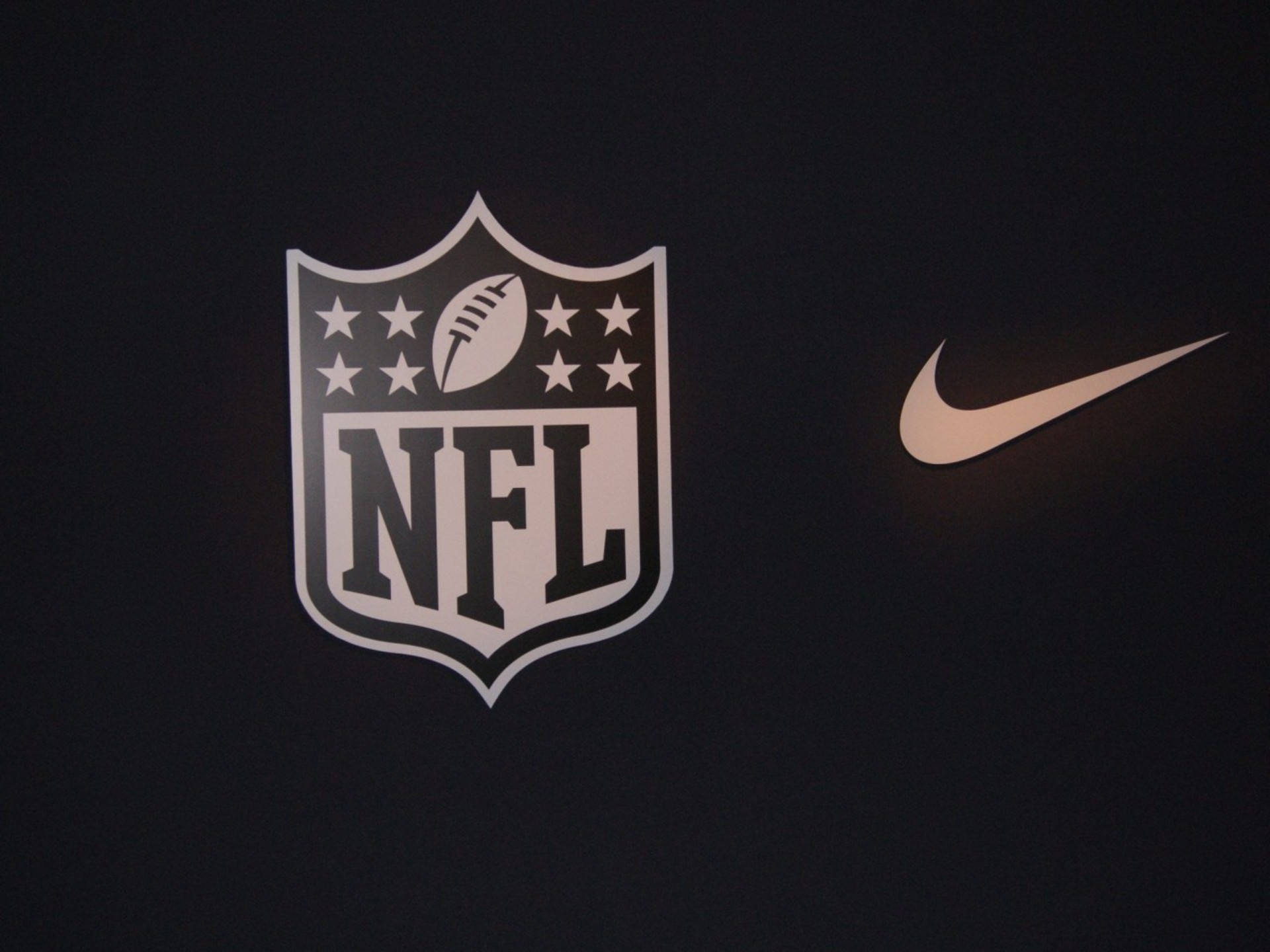 Sigle NFL Football și Nike Fundal