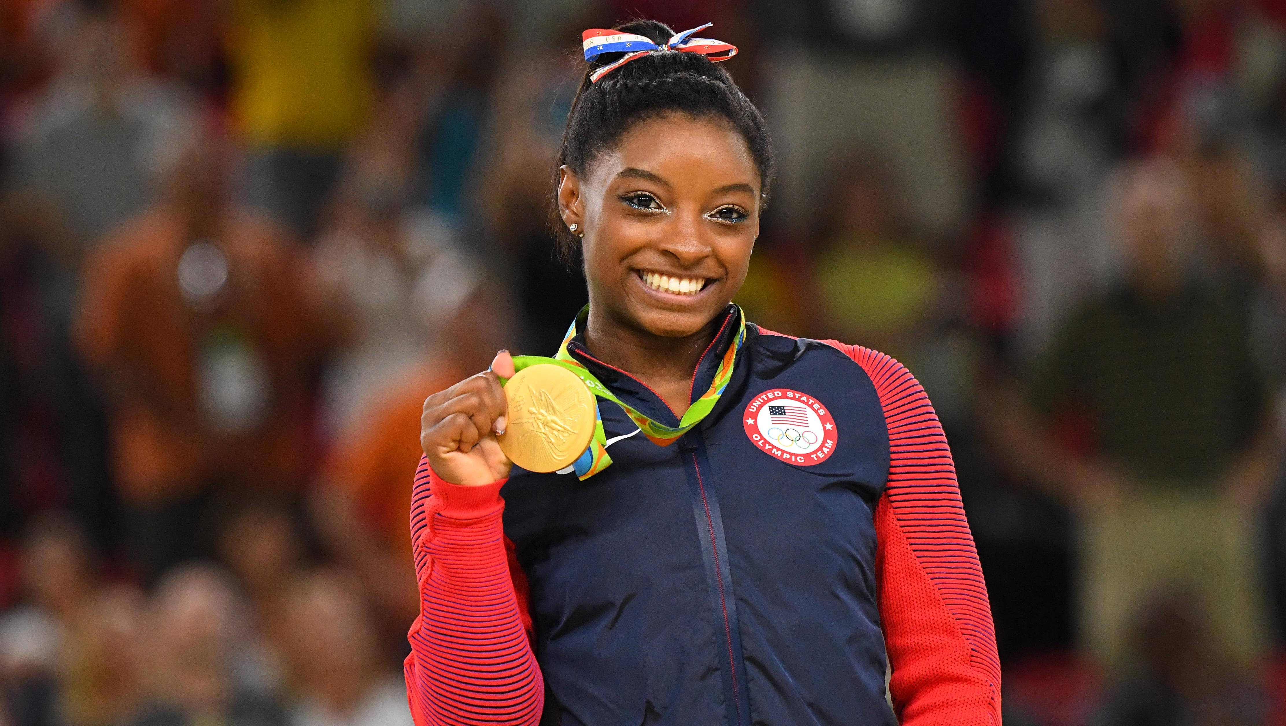 Simon Biles Wearing Gold Medal Fundal