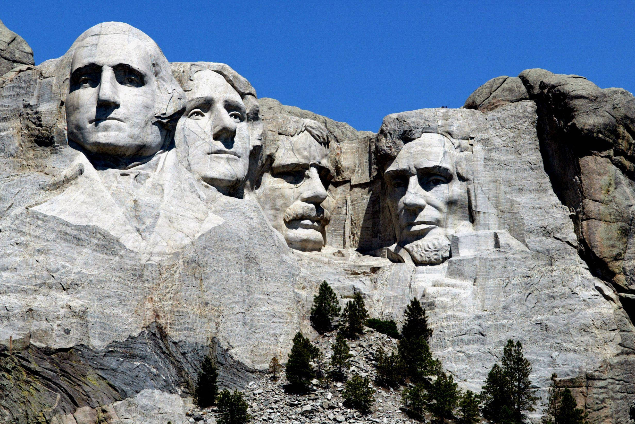 Soarele Strălucind pe Mount Rushmore Fundal