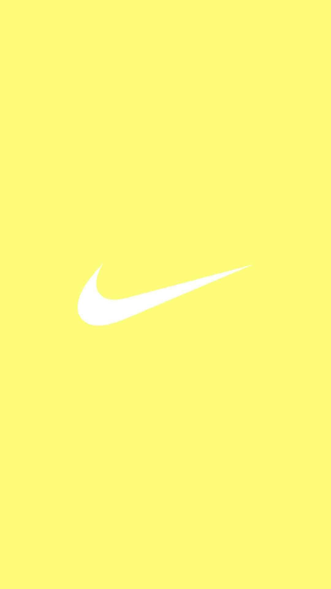 Splash fermecător de estetică galben pastel drăguț cu logo-ul iconic Nike Fundal