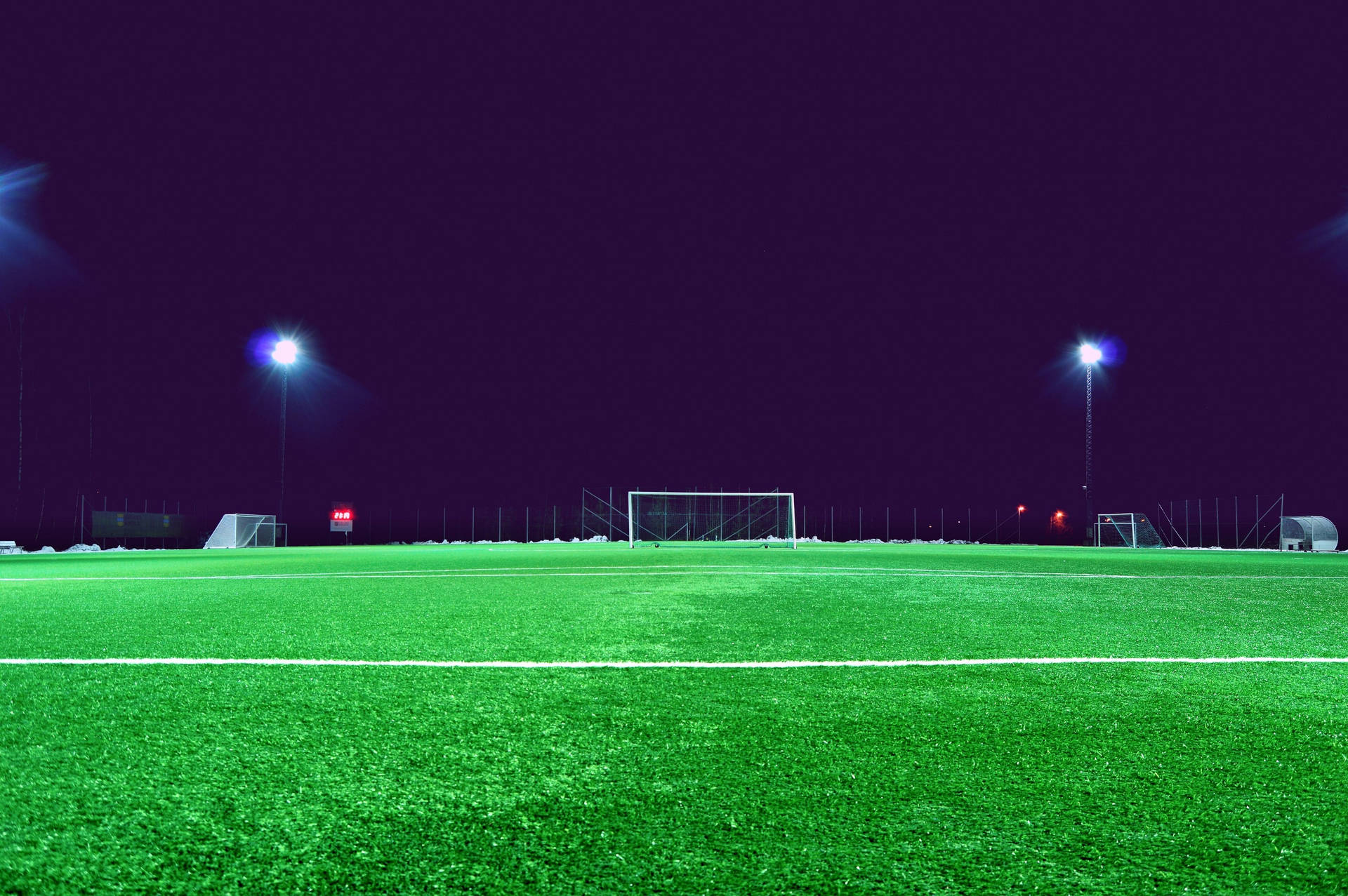Tapet cu stadion de fotbal noaptea, cu cer întunecat — Fotbal Fundal