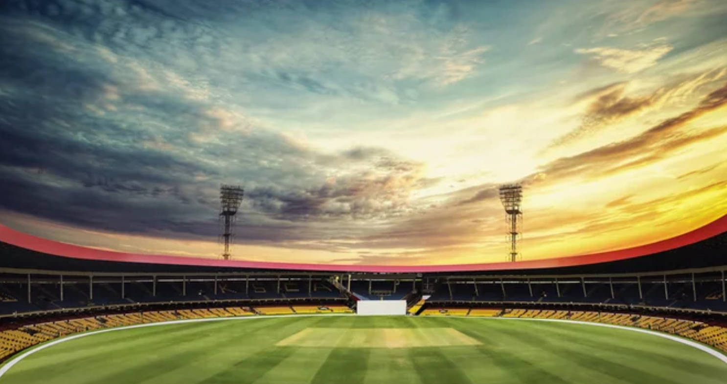 Teren de cricket la apus Fundal