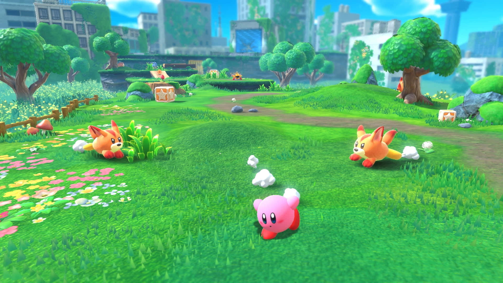 Un adorabil personaj Kirby așezat pe un morman de stele colorate Fundal