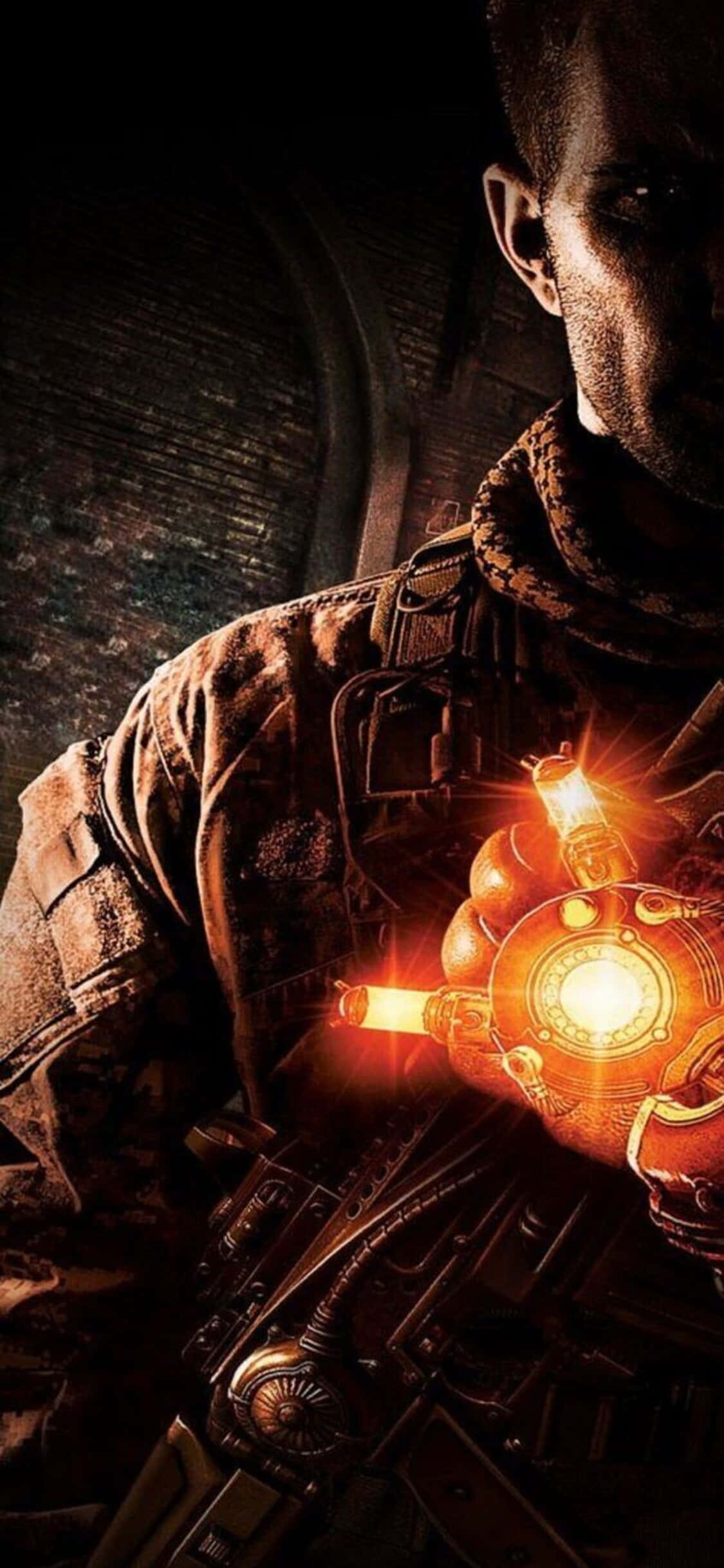 a man holding a flashlight in his hands Fundal