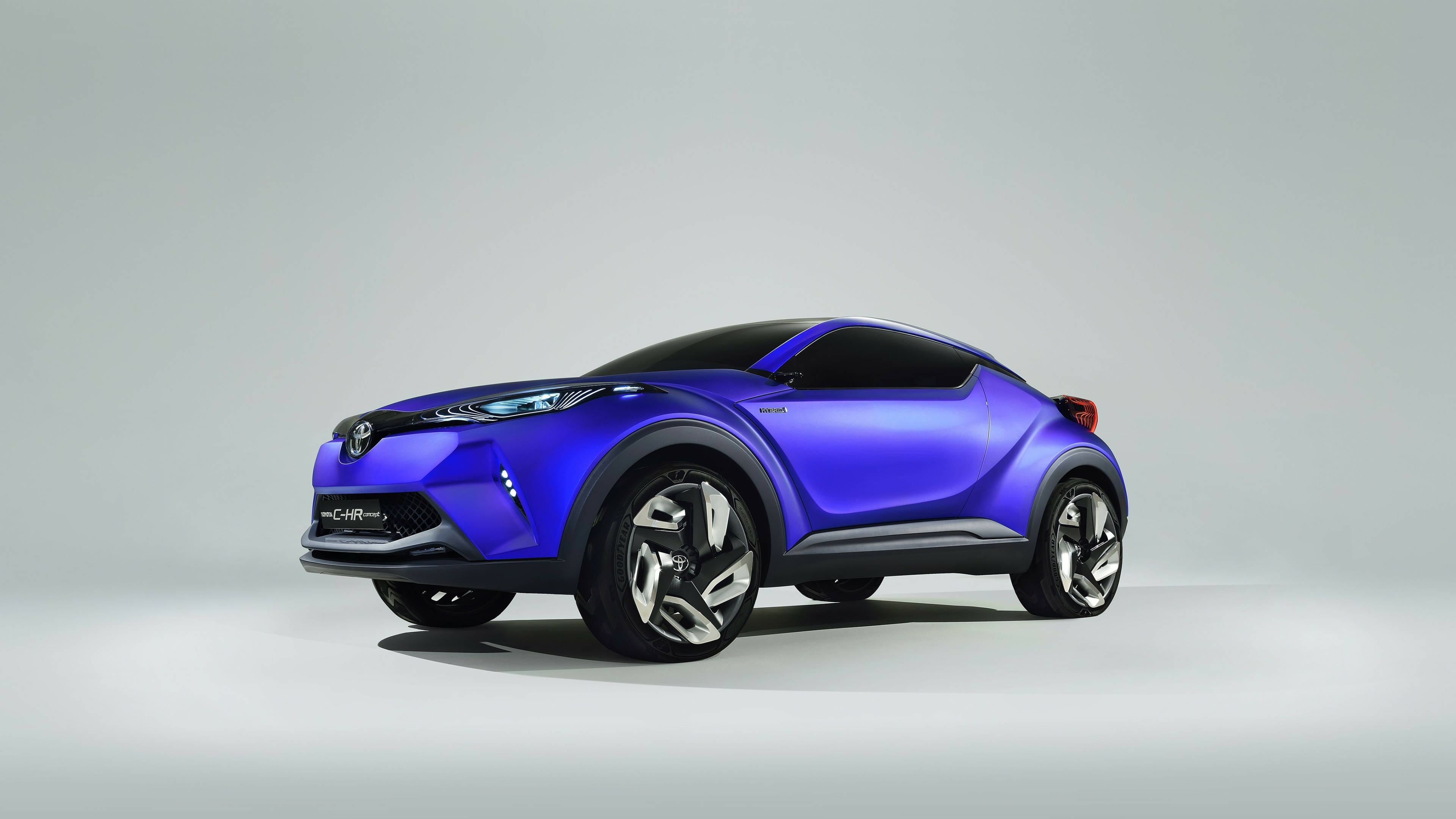 Vedere laterală a Toyota CH-R albastră 4K Fundal