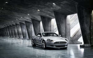 Aston Martin DB9 Plimbându-se Prin Peisaj Urban Pitoresc — 2560x1600 Fundal