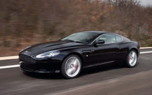 Elegantul Aston Martin DB9 pe un drum deschis — Steam Deck Fundal