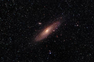 Fond de ecran cu galaxia Andromeda în Univers