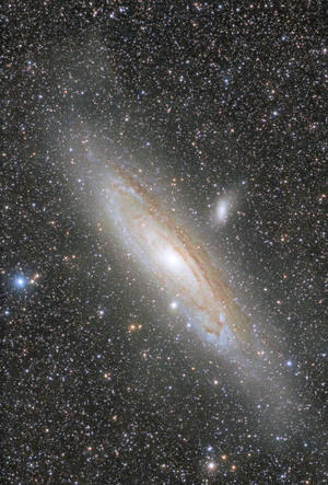 Fundal de ecran cu galaxia Andromeda în univers stelar