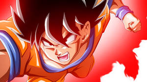 Fundal cu un Goku încărcând într-o aură portocalie strălucitoare.