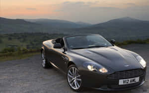 Legendă: Aston Martin DB9 elegant pe drum — 1280x800 Fundal