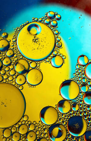 Artă abstractă fluidă cu bule pe vopsea galbenă și albastră. — Honor MagicPad 3 Pro 12.3 Fundal
