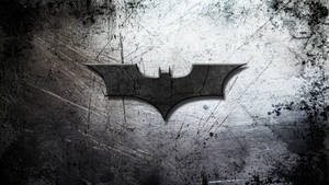 Tapet cu logo Batman deteriorat