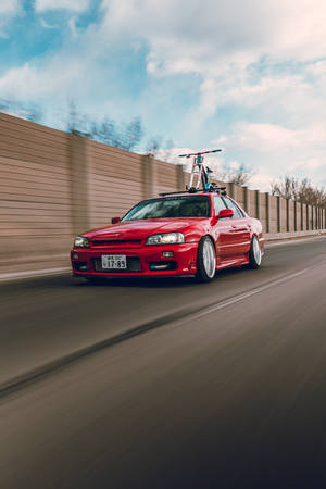 audi a 4 roșu pe drum în timpul zilei