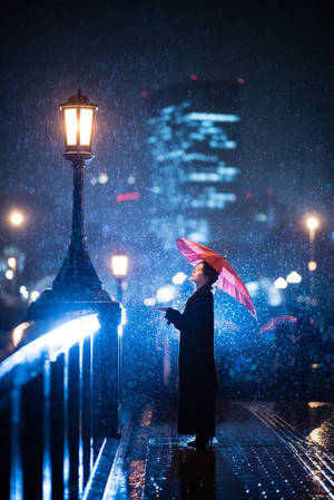 Night rain with woman in black long dress lock screen wallpaper.