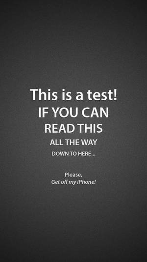 Wallpaper pentru ecran de blocare iPhone, declarația „This Is A Test”.