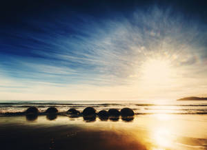Răsărit pe Plaja Moeraki Boulders wallpaper — Răsărit Fundal