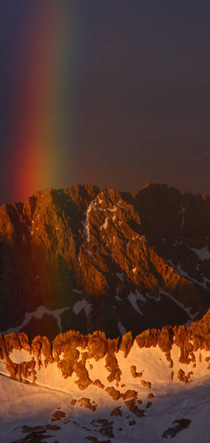 S10 curcubeu pe munte de zăpadă wallpaper — iPhone 17 Fundal