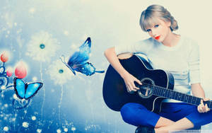 Taylor Swift cu temă albastră cântând la chitară wallpaper copertă