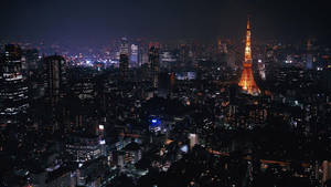 Wallpaper vedere aeriană a Turnului Tokyo în oraș noaptea