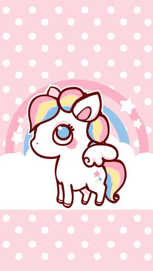 Unicorn de bomboane cu păr și coadă colorate, ochi mari și stea pe corp, pe un perete roz cu buline și curcubeu.