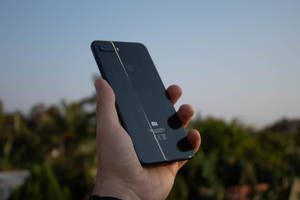 Xiaomi Smartphone în Mână — Xiaomi Fundal